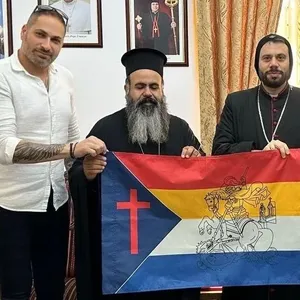Ihab Shlayan and Bishop Ephrem Semaan with Aramaic flag